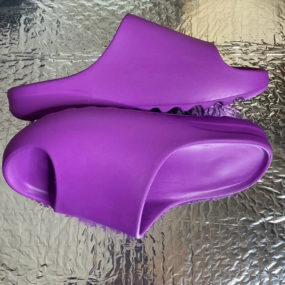 Brand new purple slides never worn. Yes ready for your feet. Vacation ready.